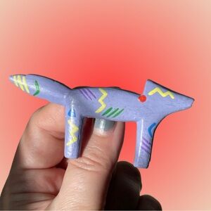 Vintage Southwestern style carved wood purple coyote brooch